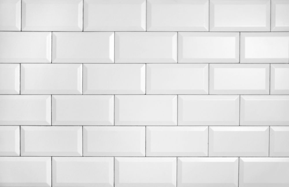 A Close Up of a Row of White Subway Tiles on a Wall — Tileflair in Mitchell, ACT