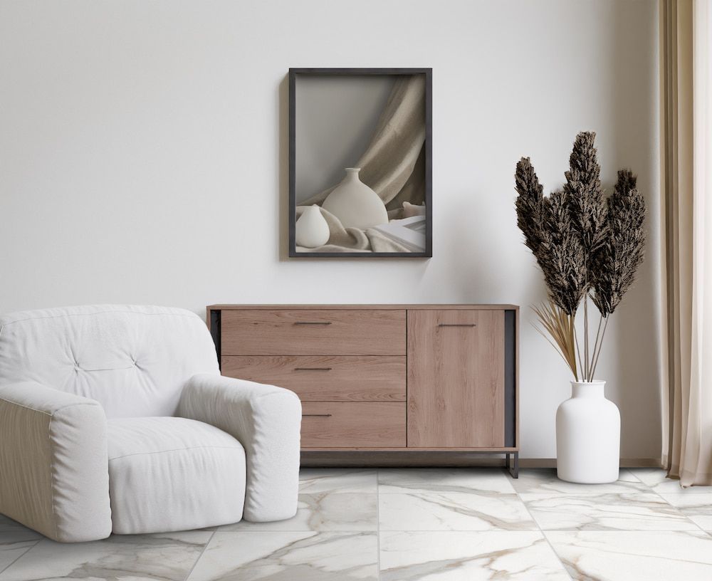 A Living Room With a Chair, Dresser, Vases and a Picture on the Wall — Tileflair in Mitchell, ACT