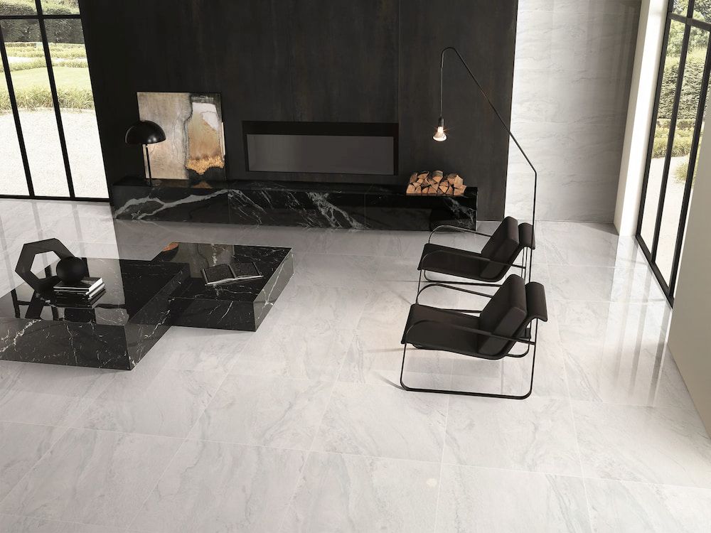 A Living Room With Two Chairs, a Coffee Table and a Fireplace — Tileflair in Mitchell, ACT