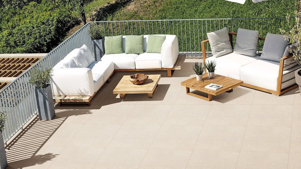 A Patio With a Couch, Chairs and a Coffee Table — Tileflair in Mitchell, ACT