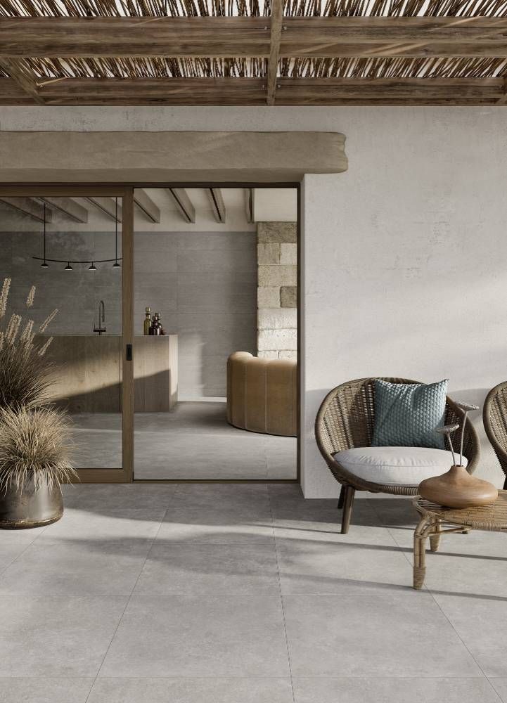 There is a Sliding Glass Door Between the Living Room and the Kitchen — Tileflair in Mitchell, ACT