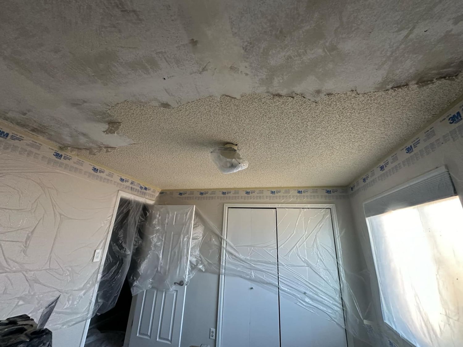 A room with a ceiling that is covered in plastic.