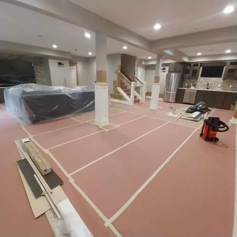 A large room with a vacuum cleaner on the floor