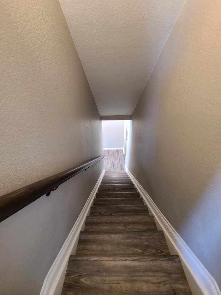 A set of stairs leading up to the second floor of a house.