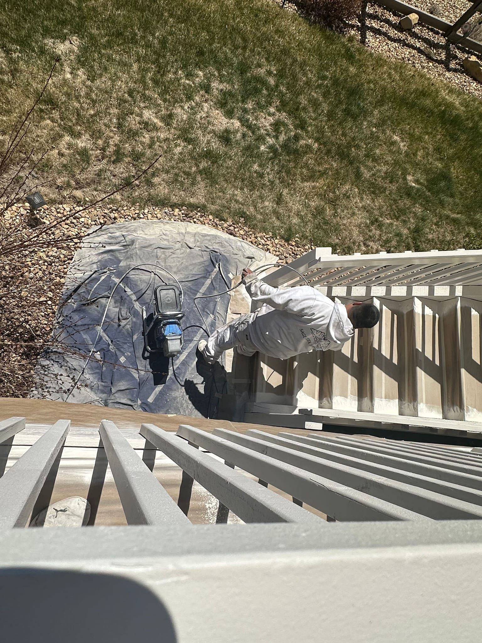 A man is standing on top of a set of stairs.