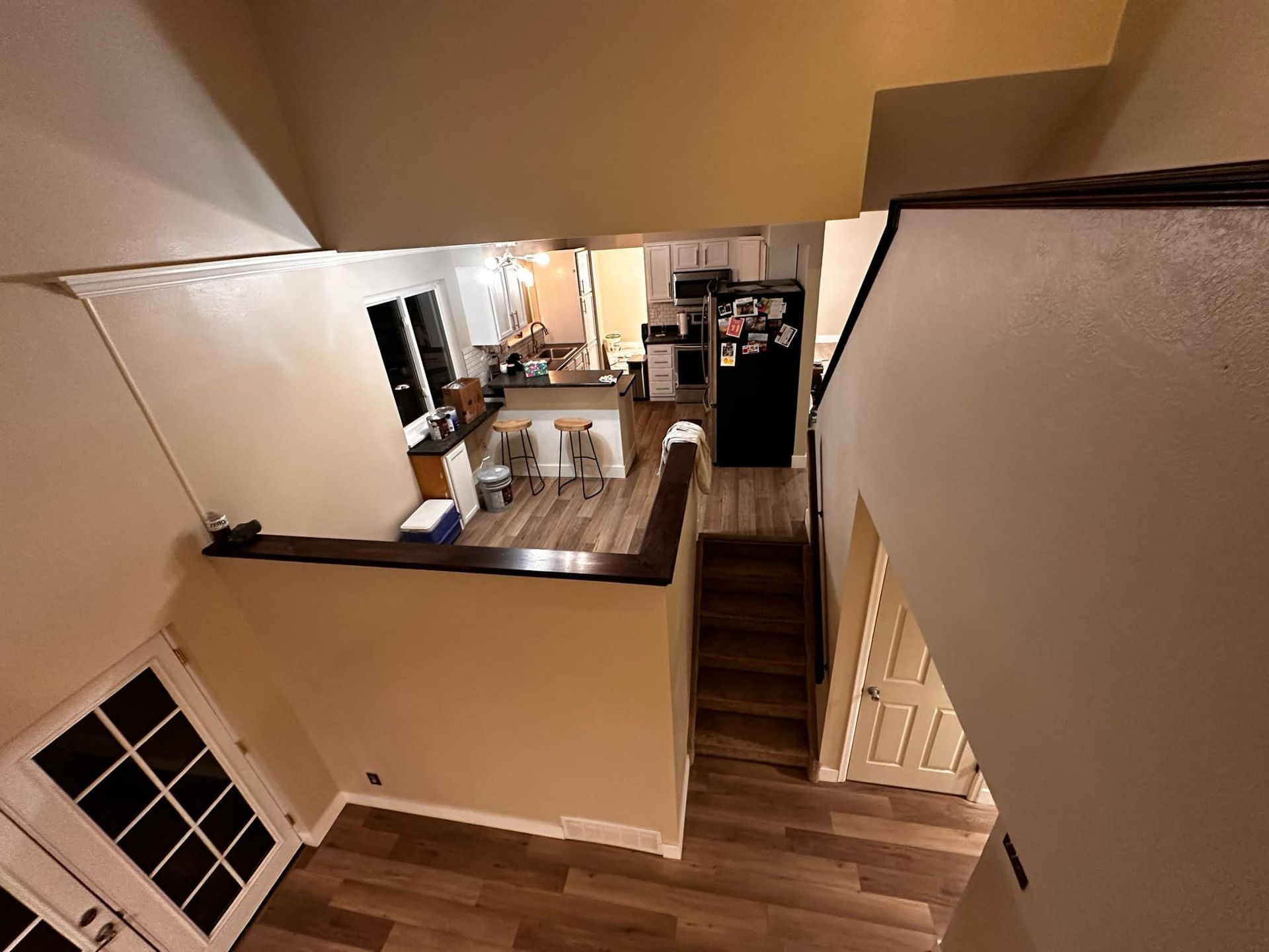An aerial view of a house with stairs leading up to the second floor.