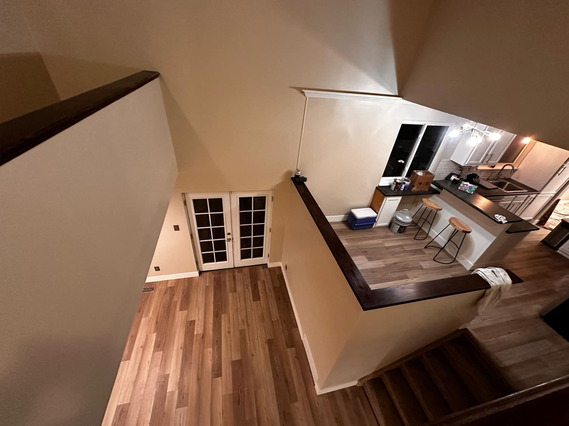 An aerial view of a house with hardwood floors and stairs