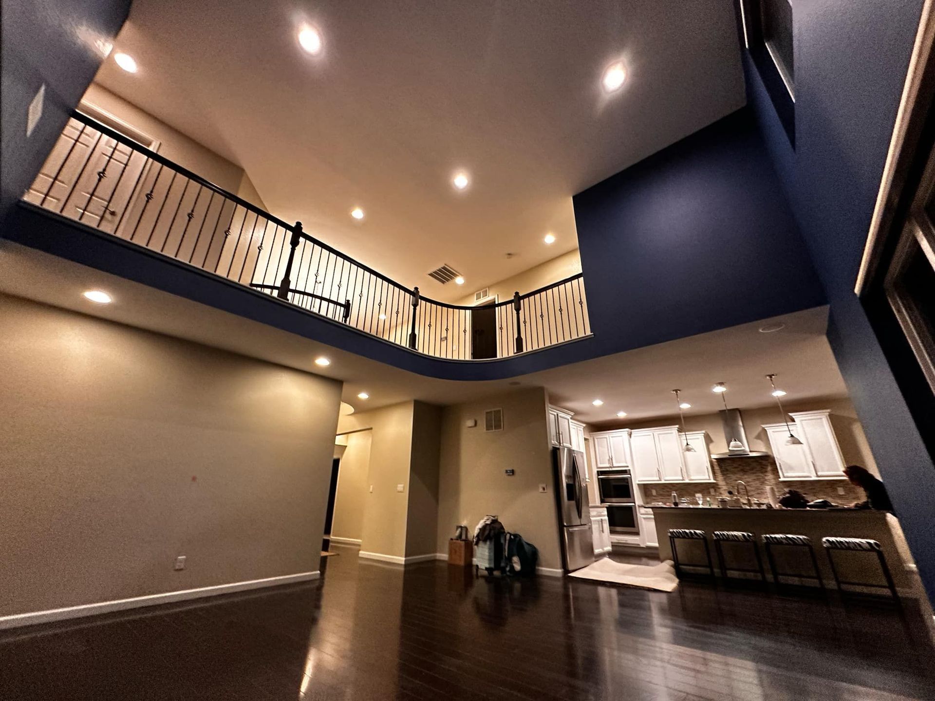 An empty house with a balcony and stairs