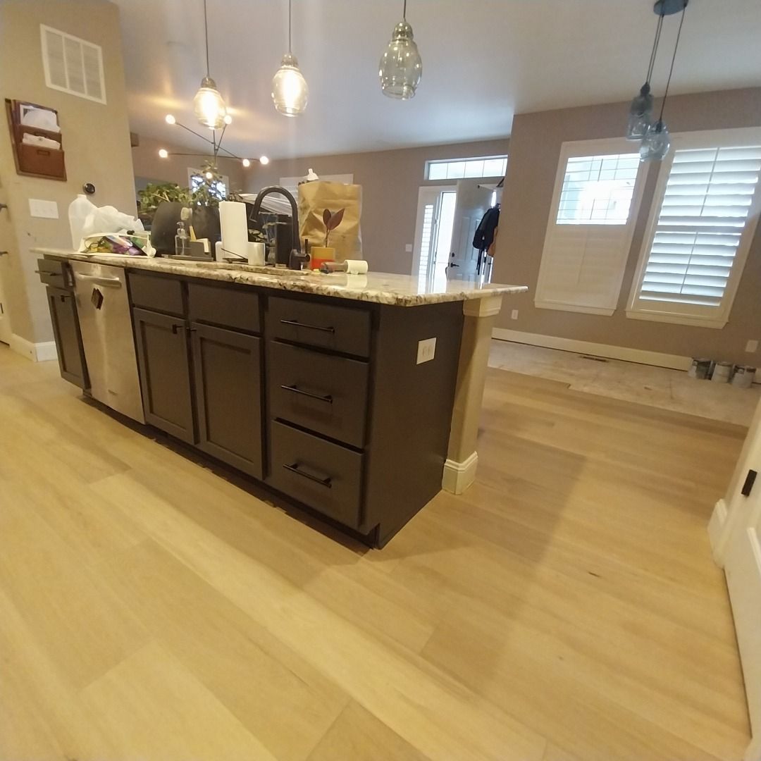 A kitchen with a large island in the middle