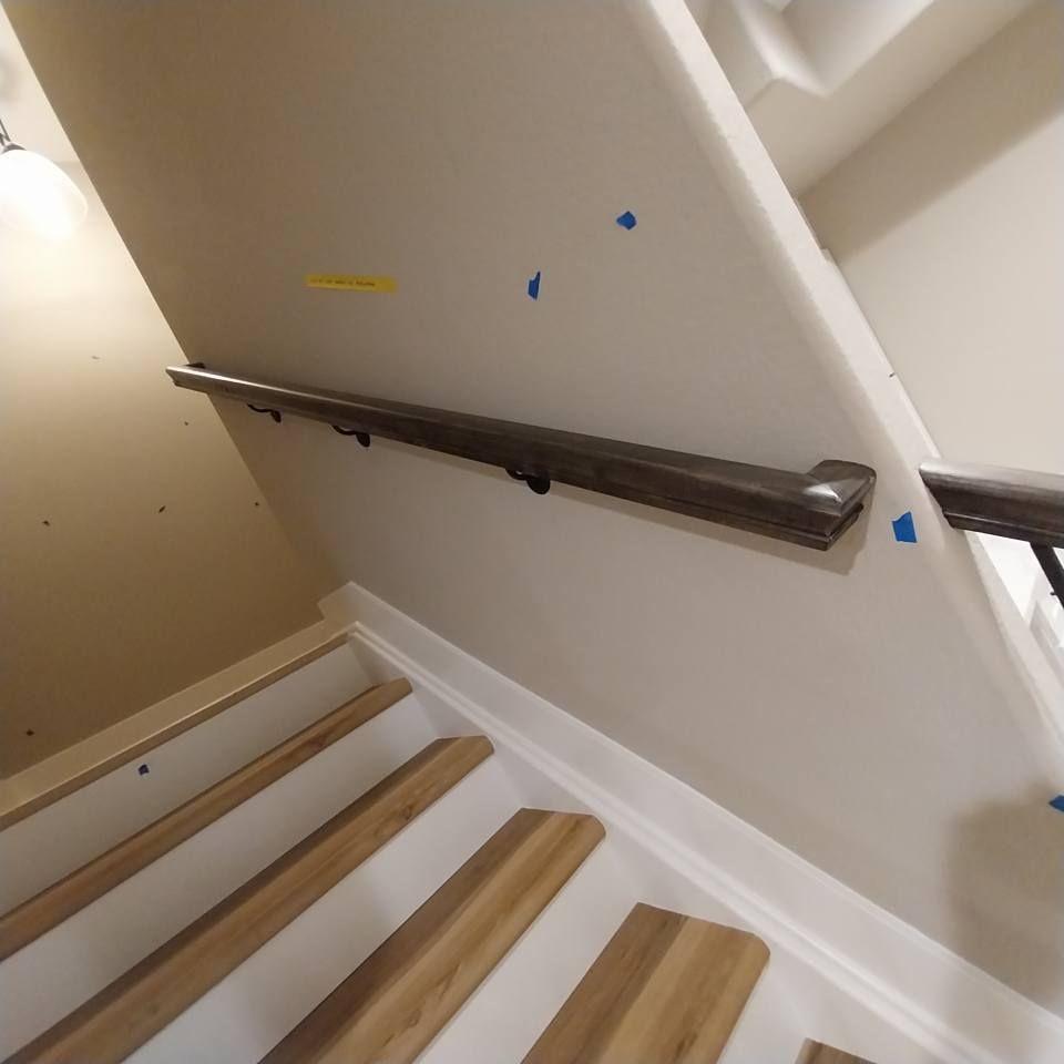 A staircase with wooden steps and a metal railing