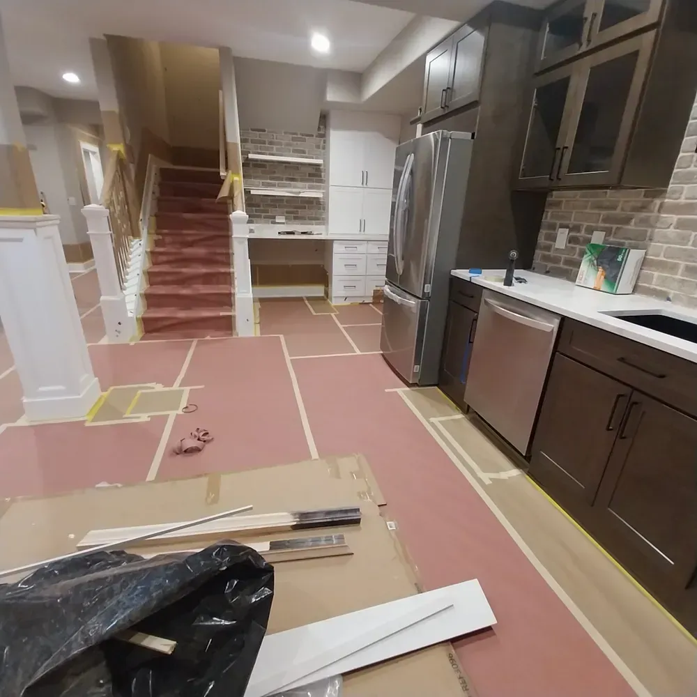 A kitchen with stainless steel appliances and wooden cabinets