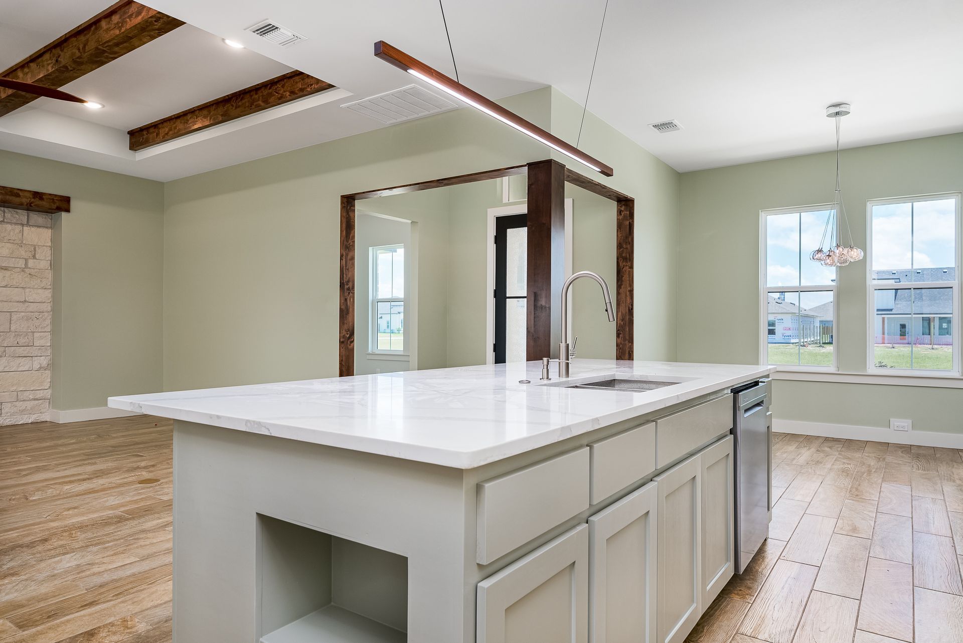 There is a large island in the middle of the kitchen.