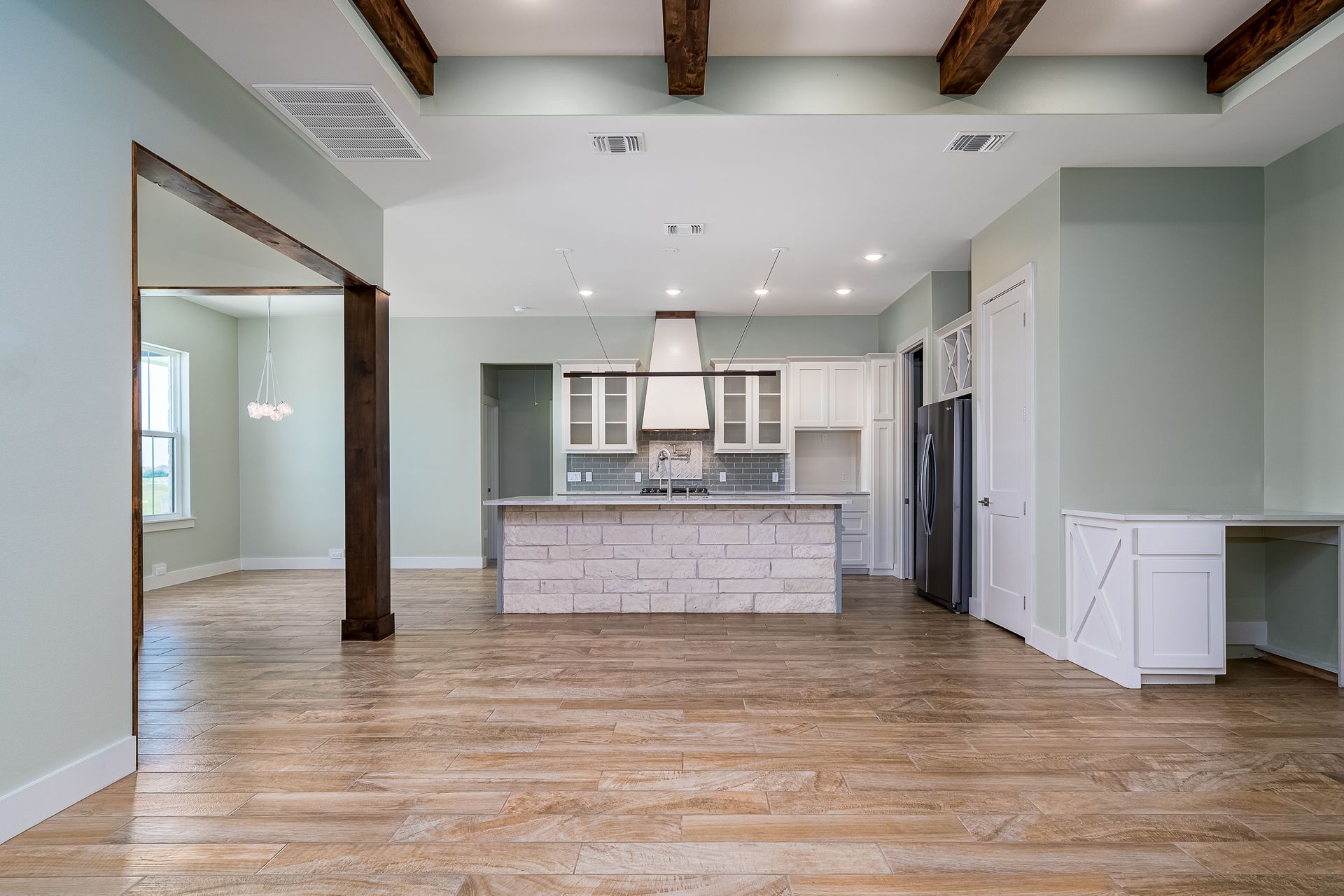 There is a large island in the middle of the kitchen.