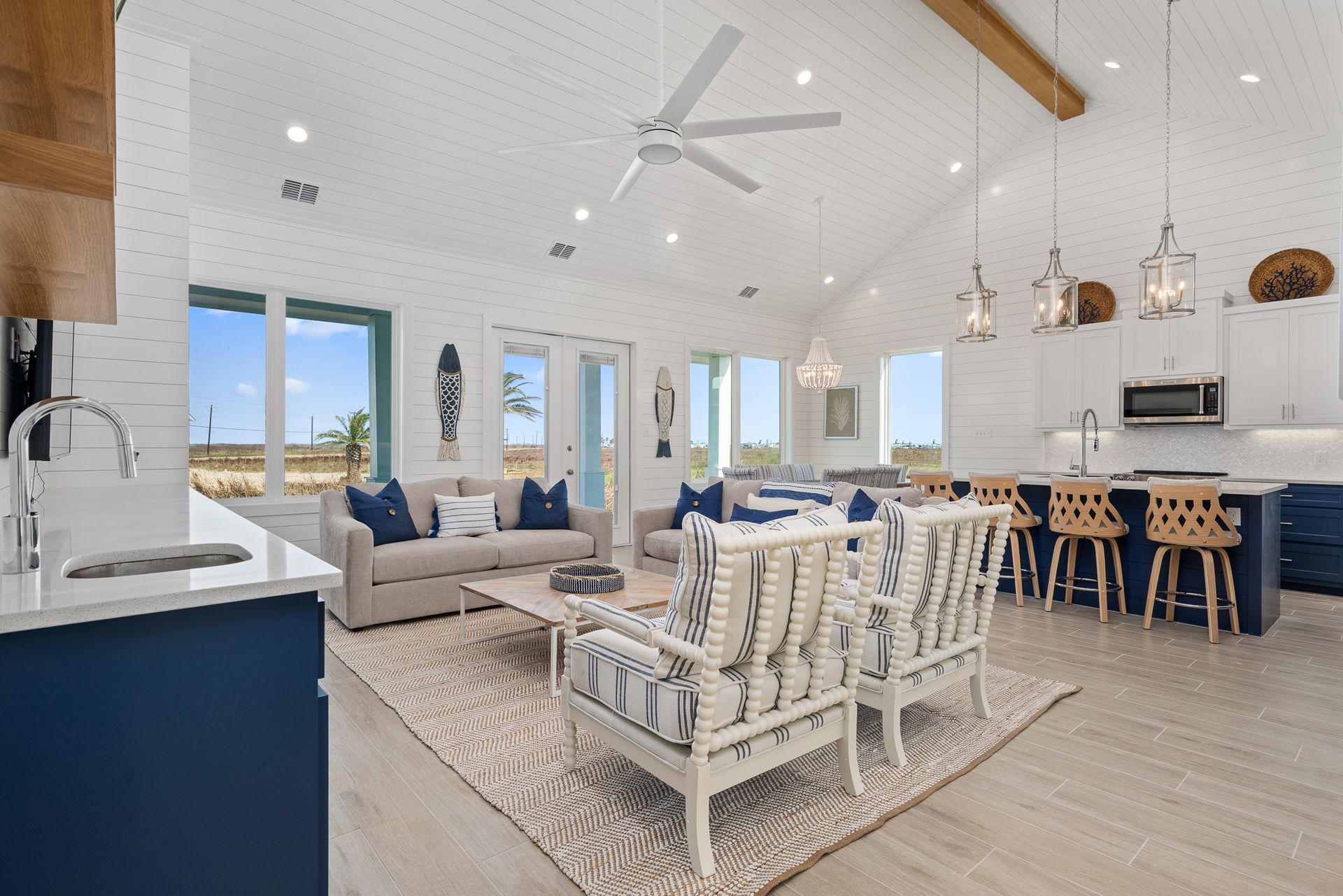 A living room filled with furniture and a ceiling fan.