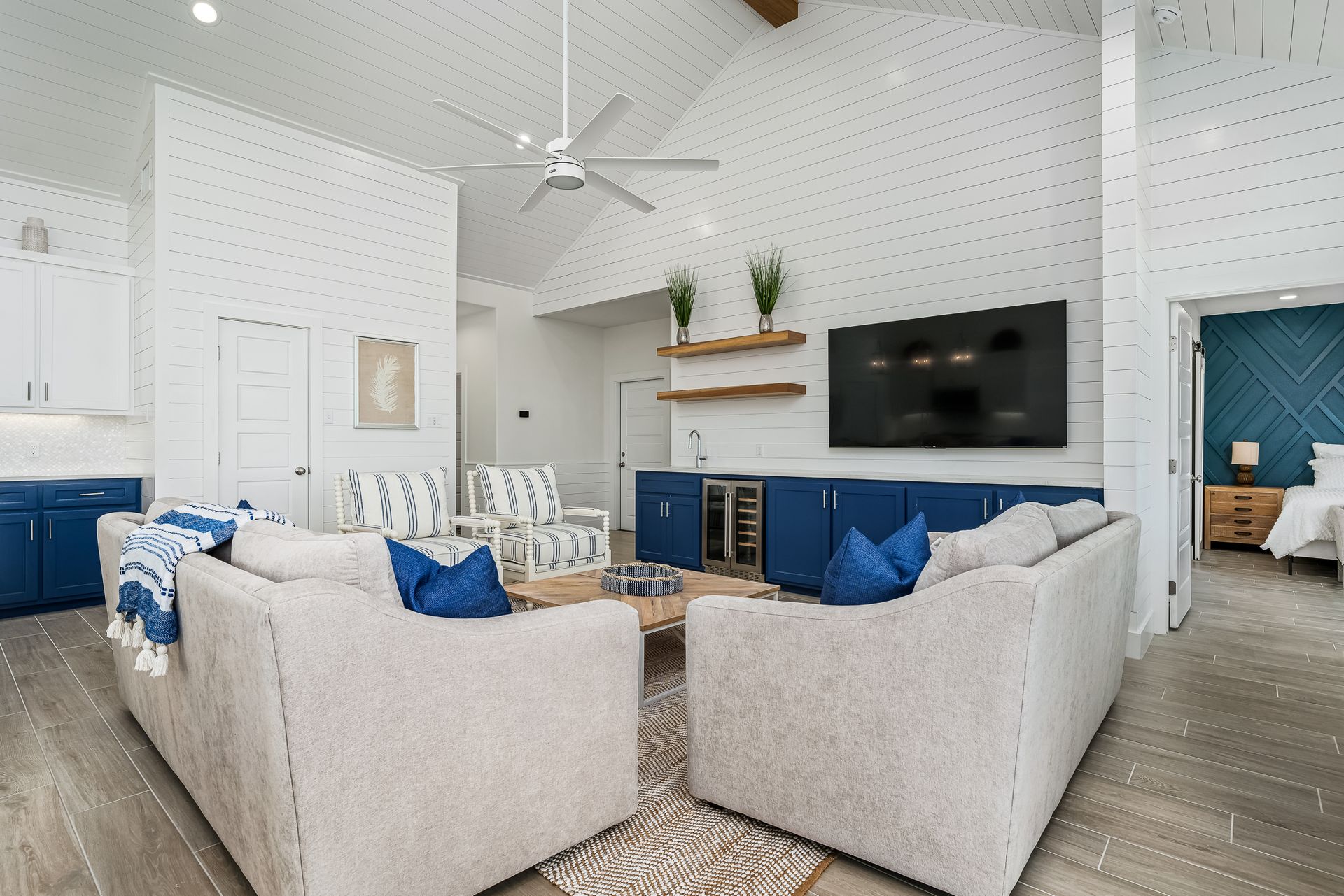 A living room filled with furniture and a flat screen tv.