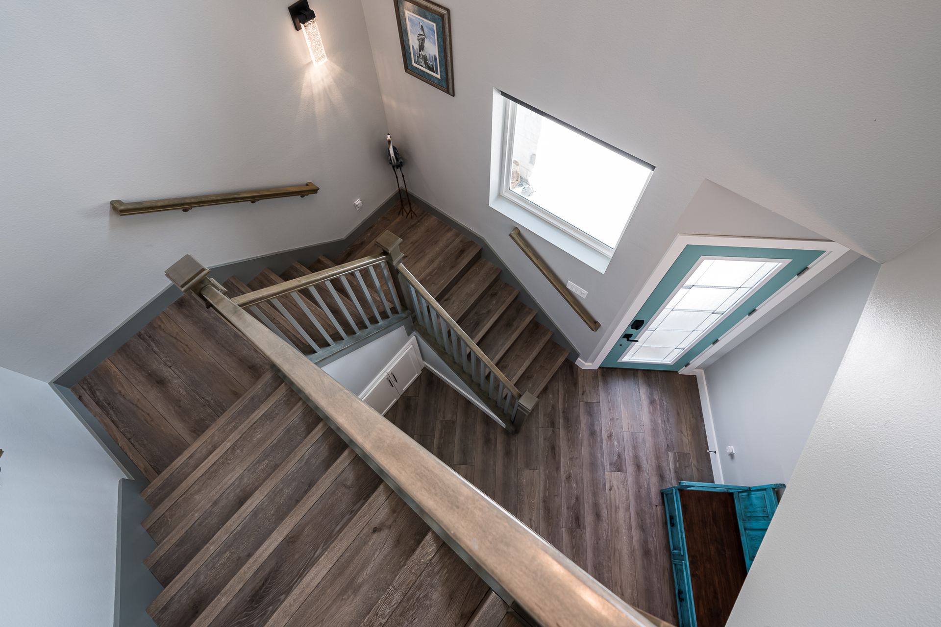An aerial view of a staircase leading up to the second floor of a house.