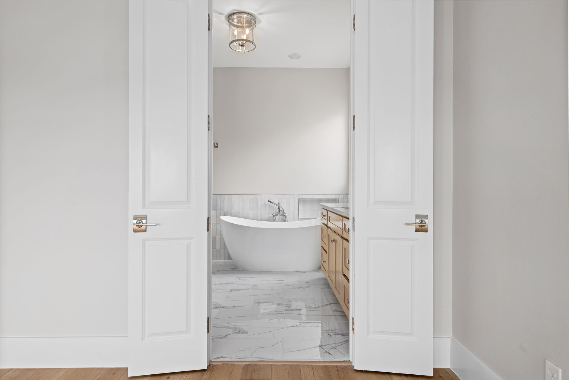 A bathroom with a bathtub and a sink in it.