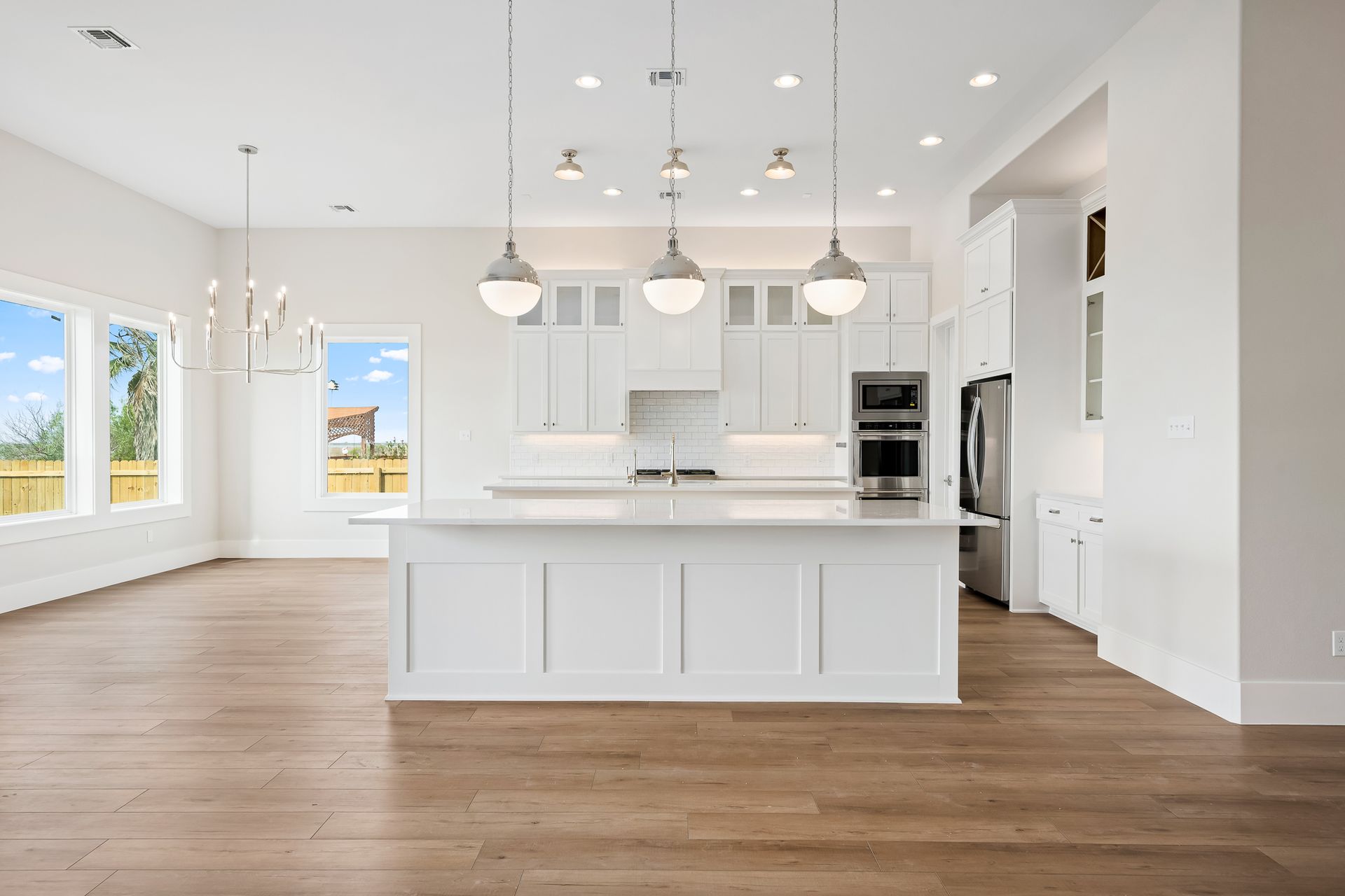 There is a large island in the middle of the kitchen.