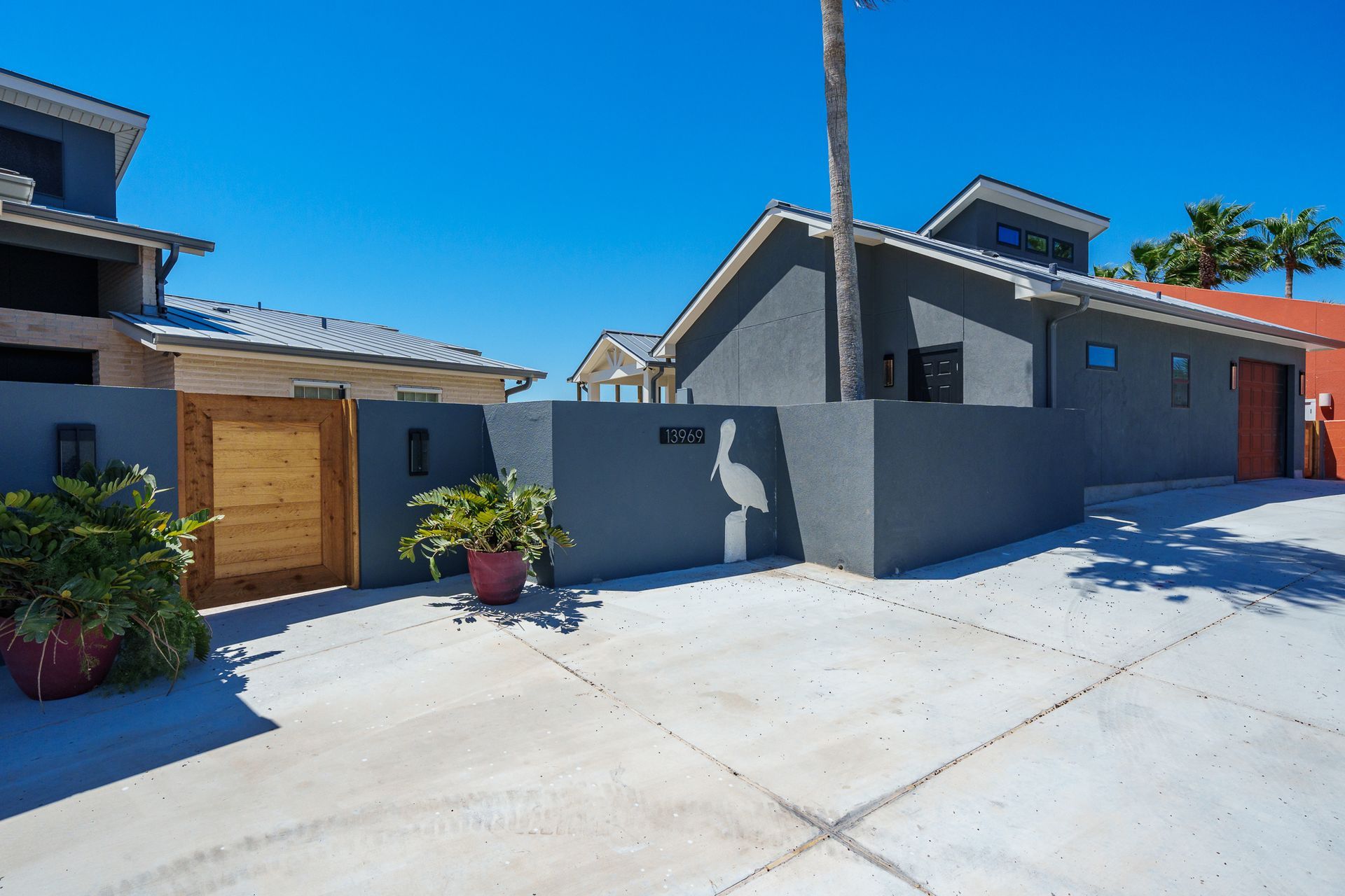 A house with a wooden gate in front of it