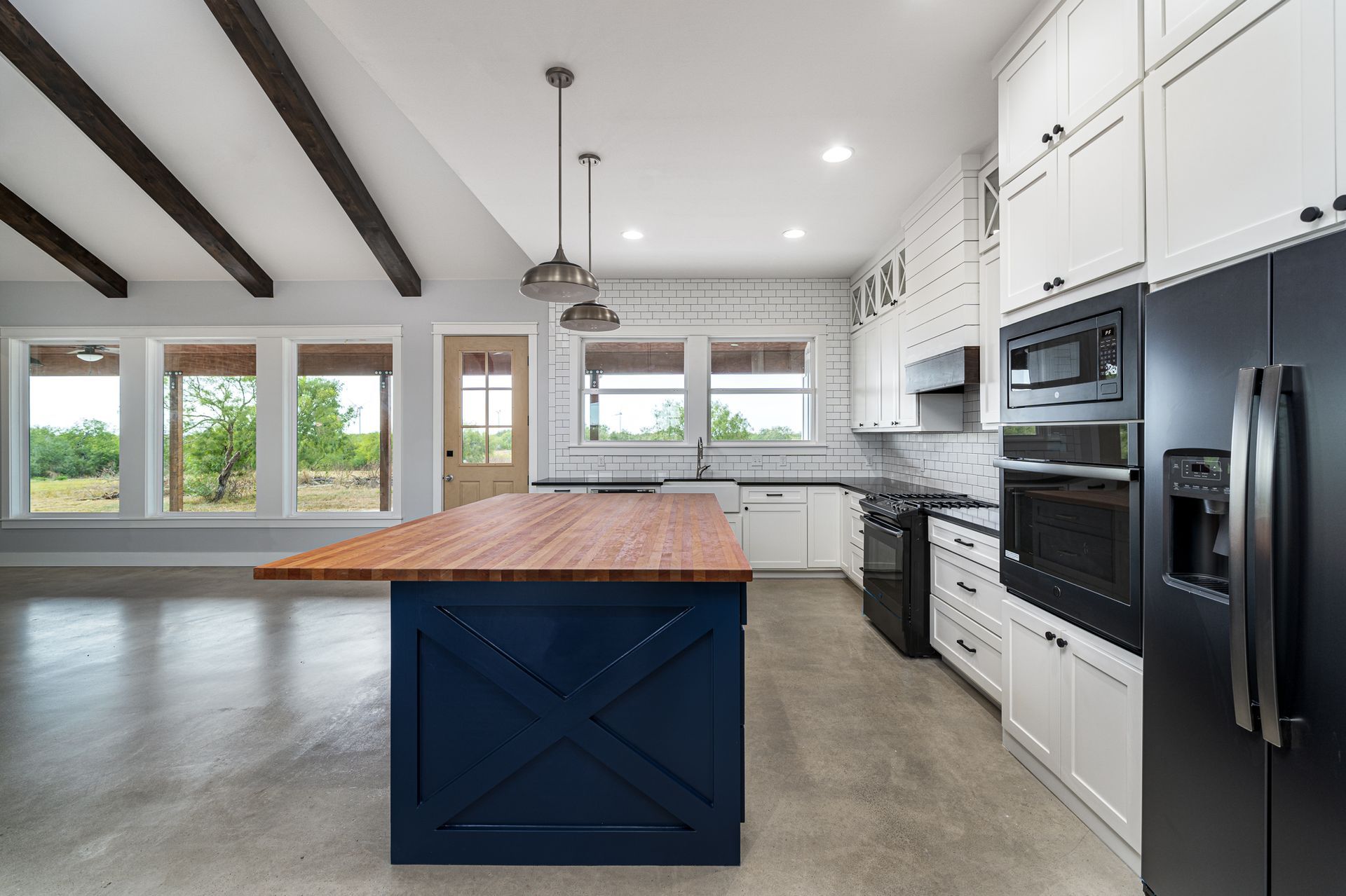 A kitchen with a large island in the middle of it.