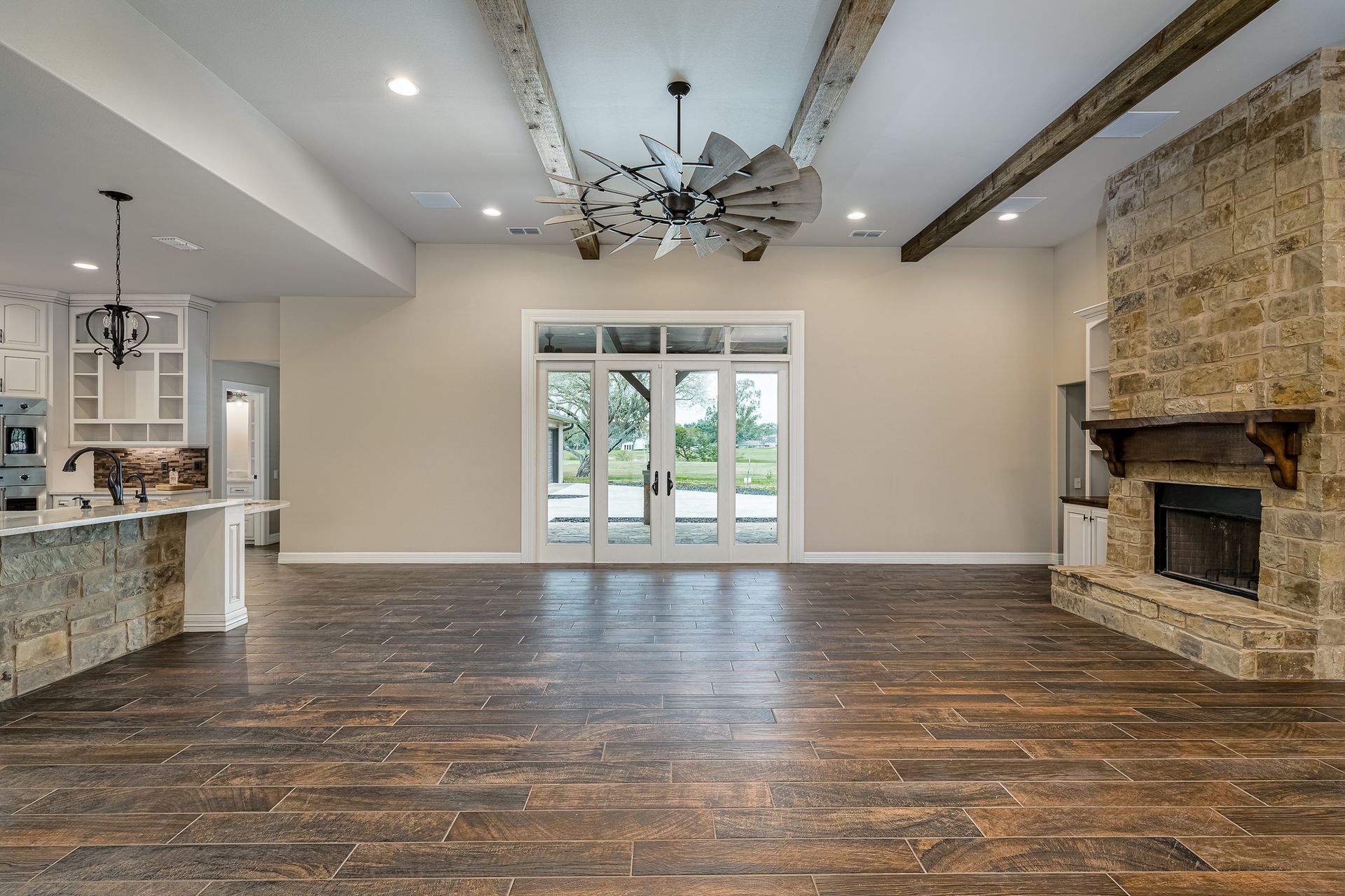 There is a fireplace in the middle of the living room.