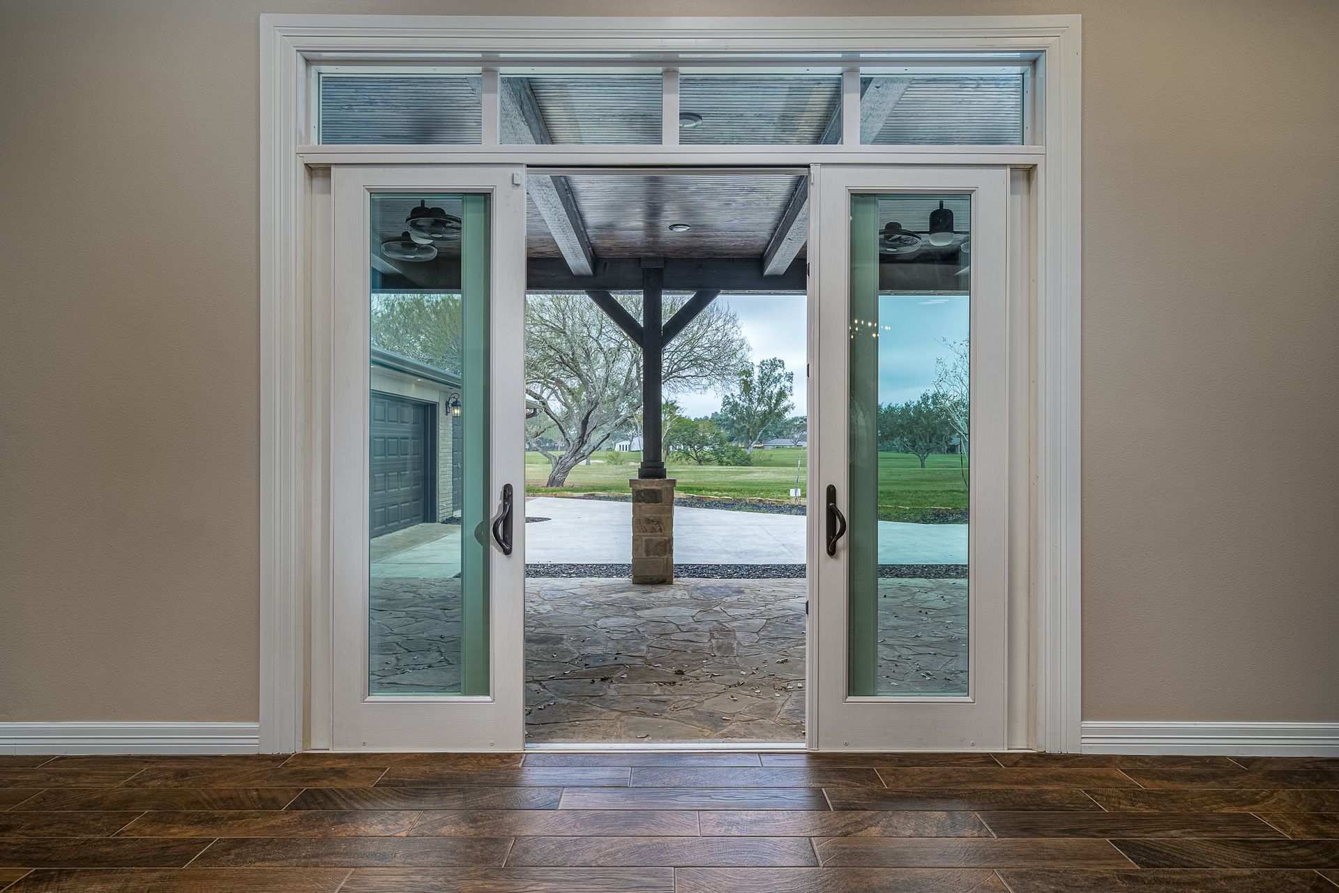 A room with sliding glass doors leading to a porch