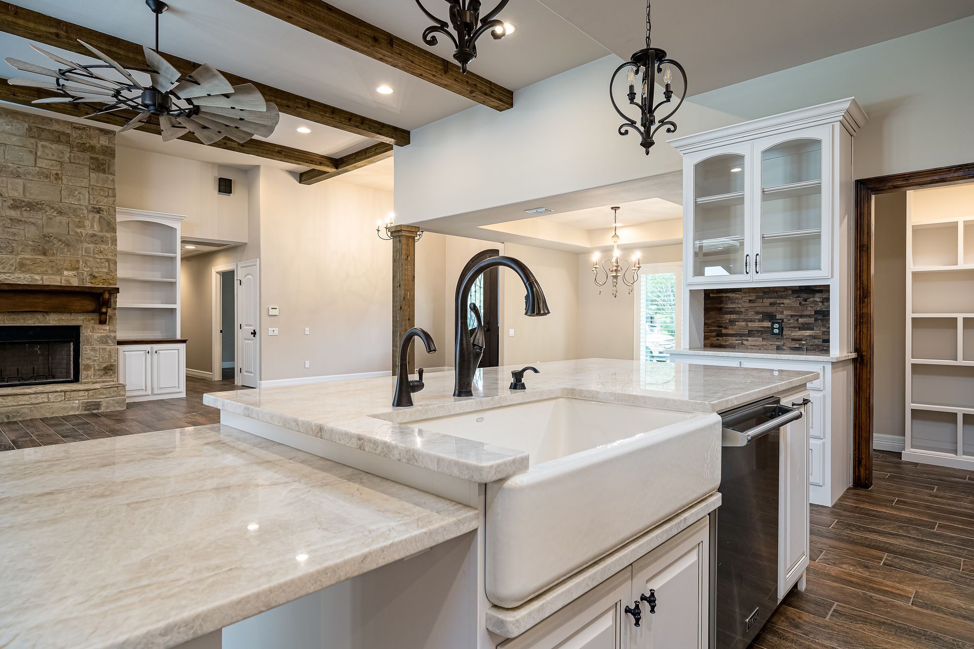 A kitchen with a farmhouse sink and stainless steel appliances.