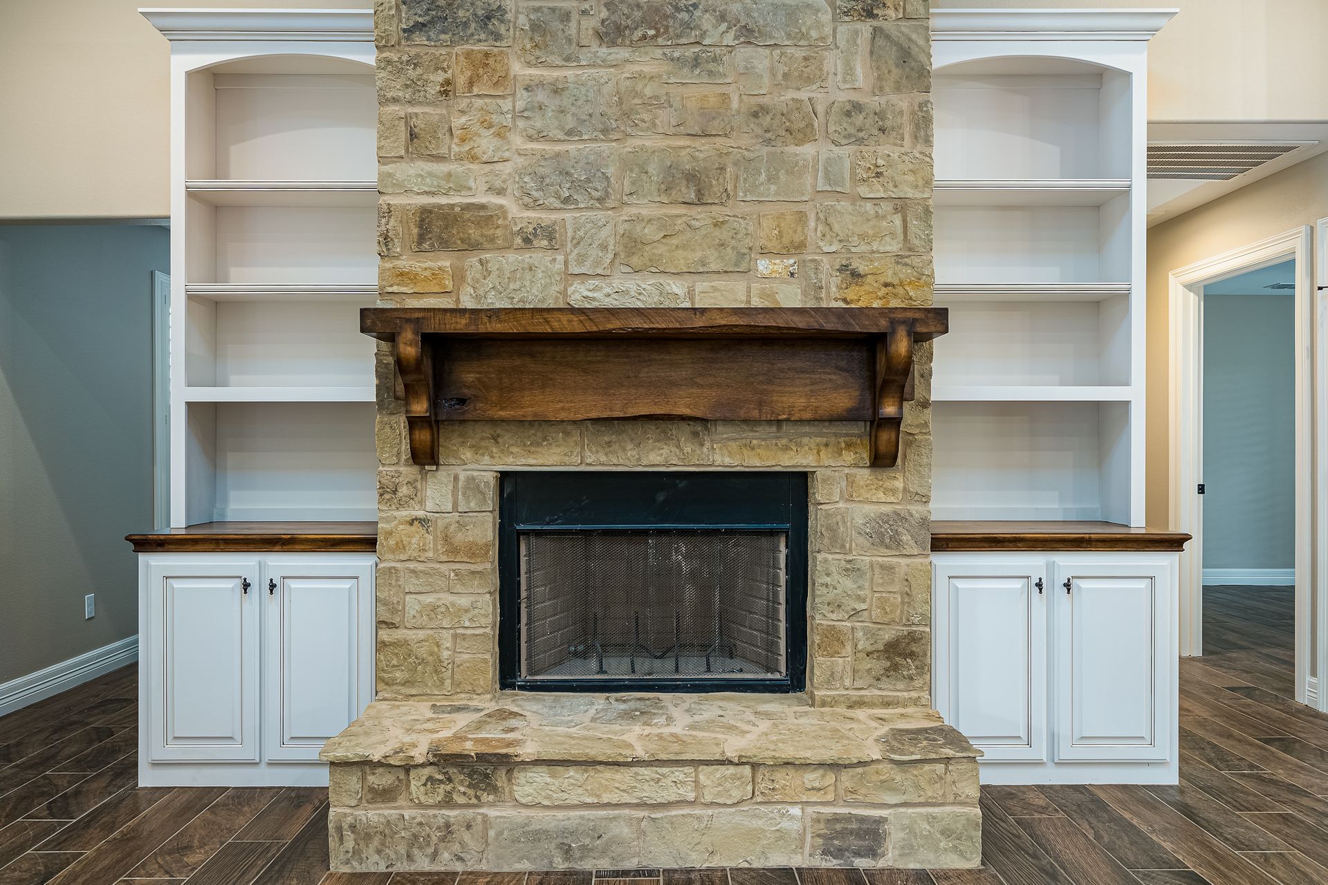 There is a fireplace in the middle of the room.