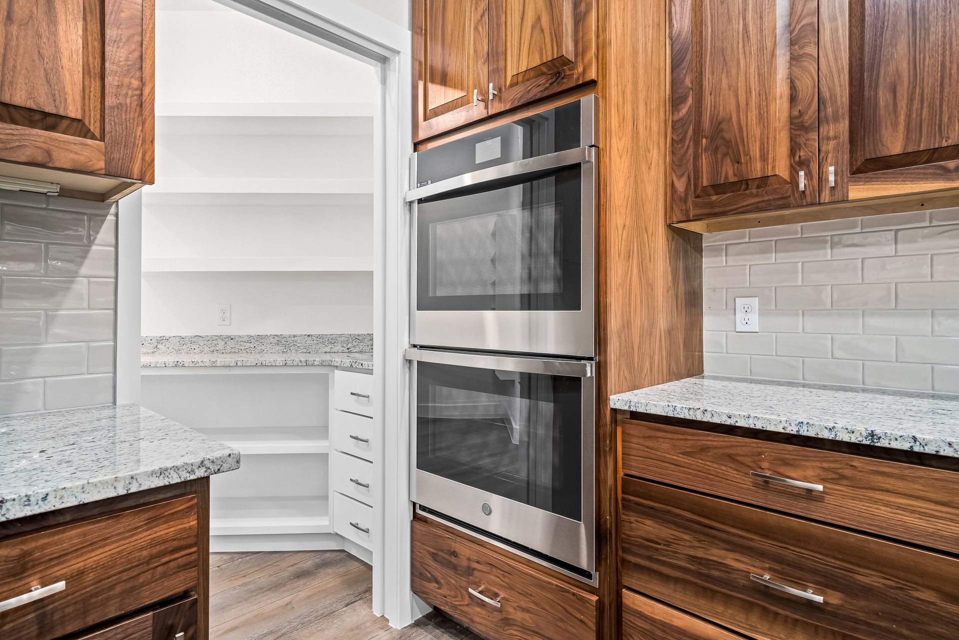 A kitchen with wooden cabinets and stainless steel appliances.