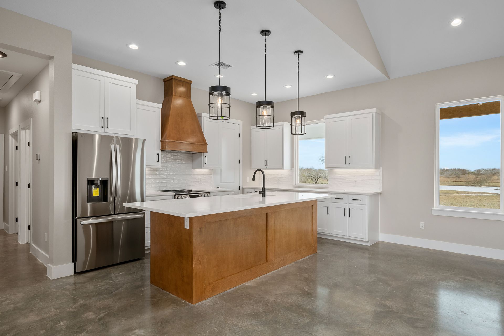 There is a large island in the middle of the kitchen.