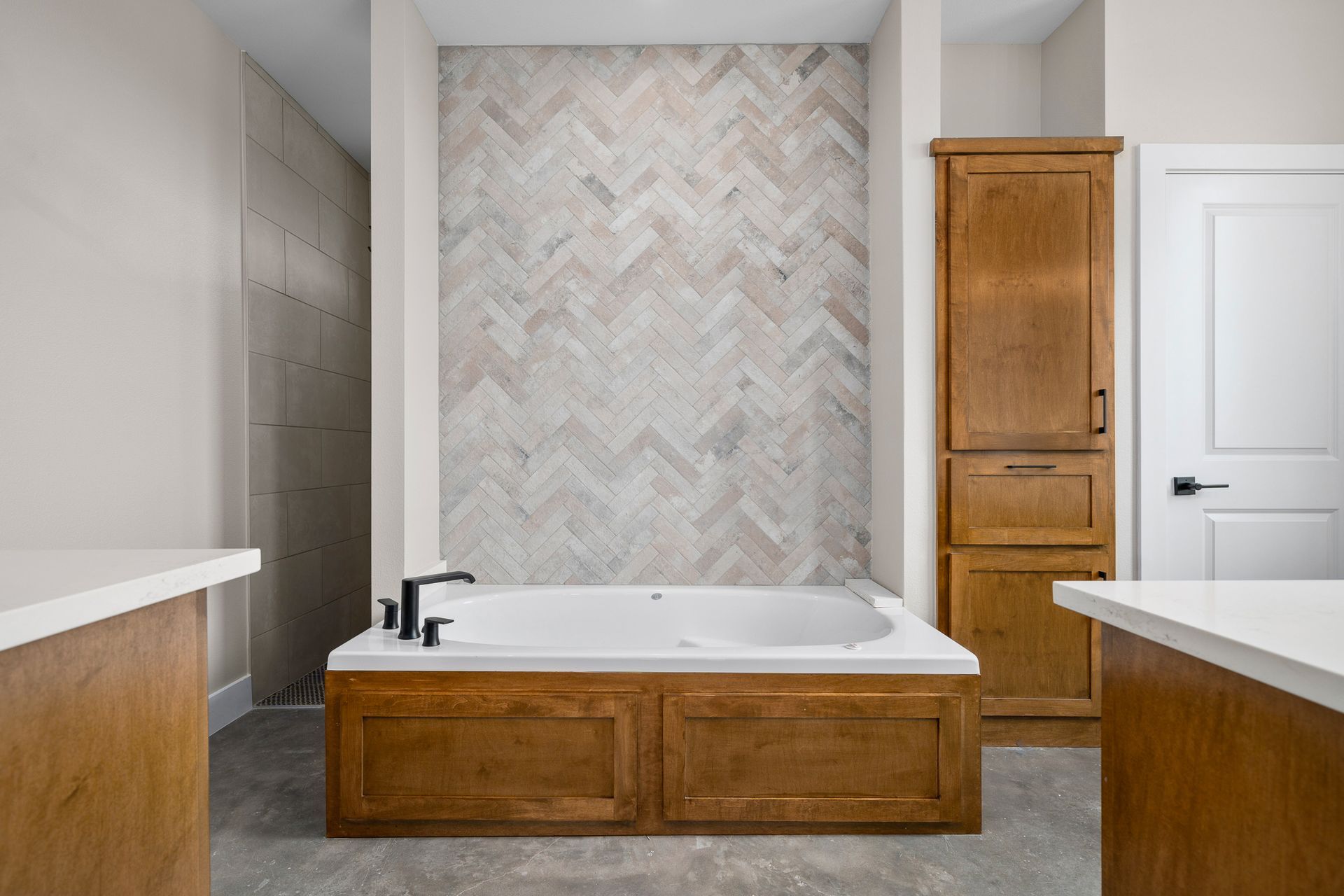 There is a bathtub in the middle of the bathroom.