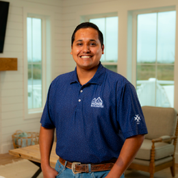 A man wearing a blue shirt with the word home on it