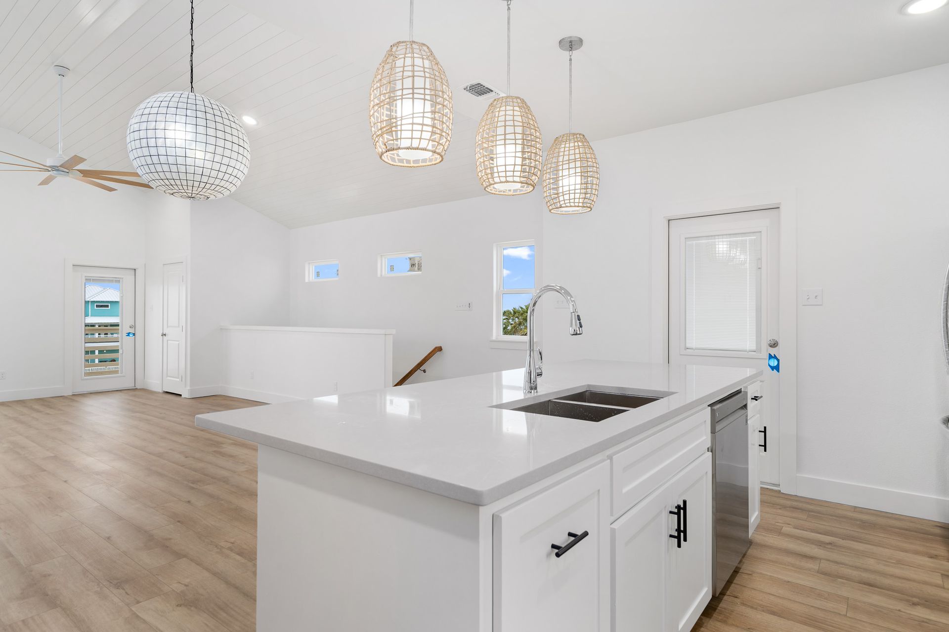 There is a large island in the middle of the kitchen.