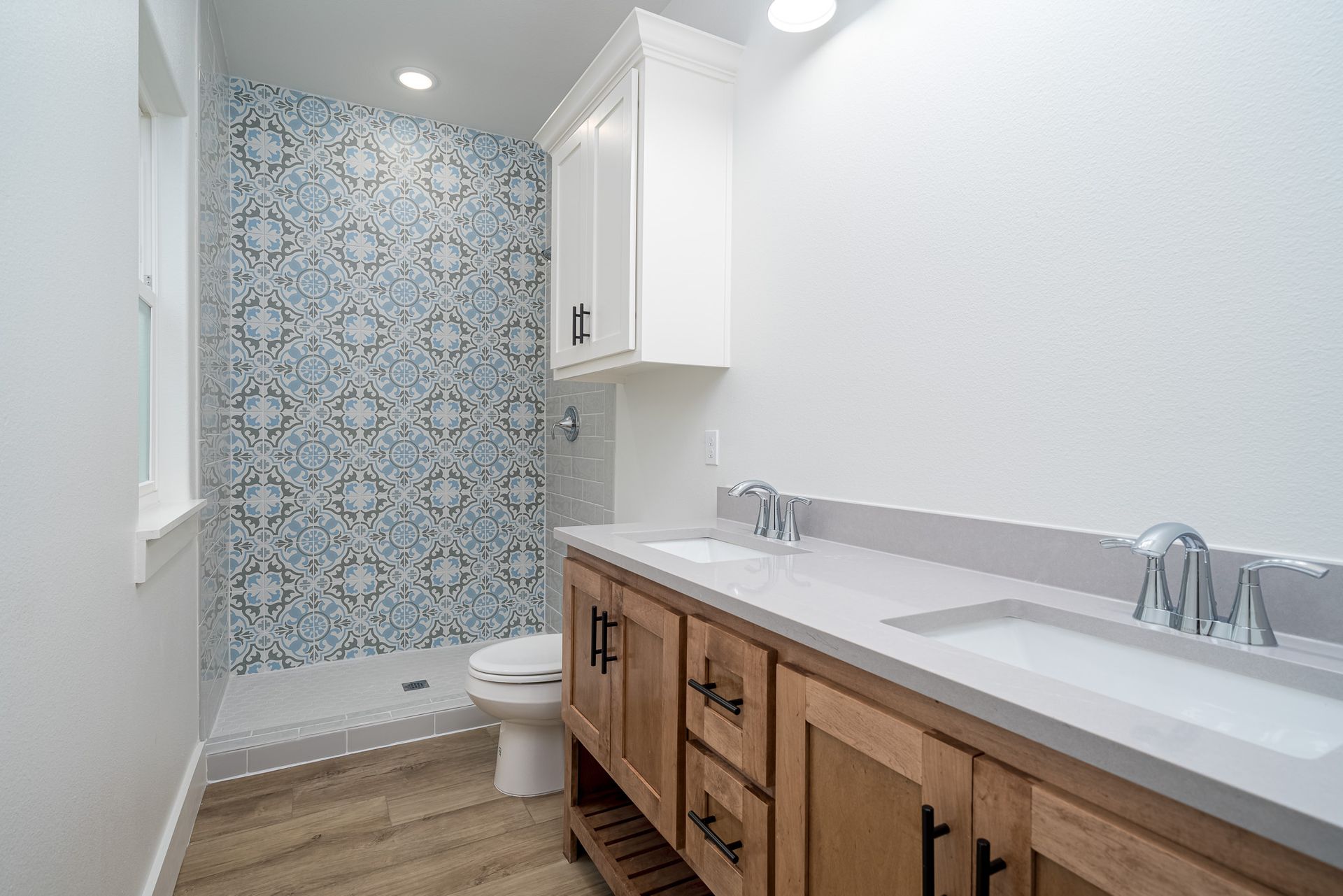 A bathroom with a toilet , sink , and shower.
