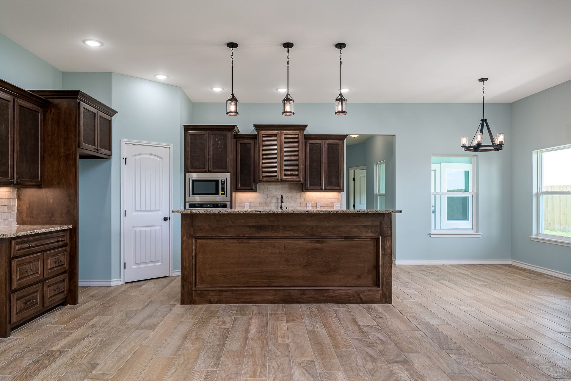 There is a large island in the middle of the kitchen.