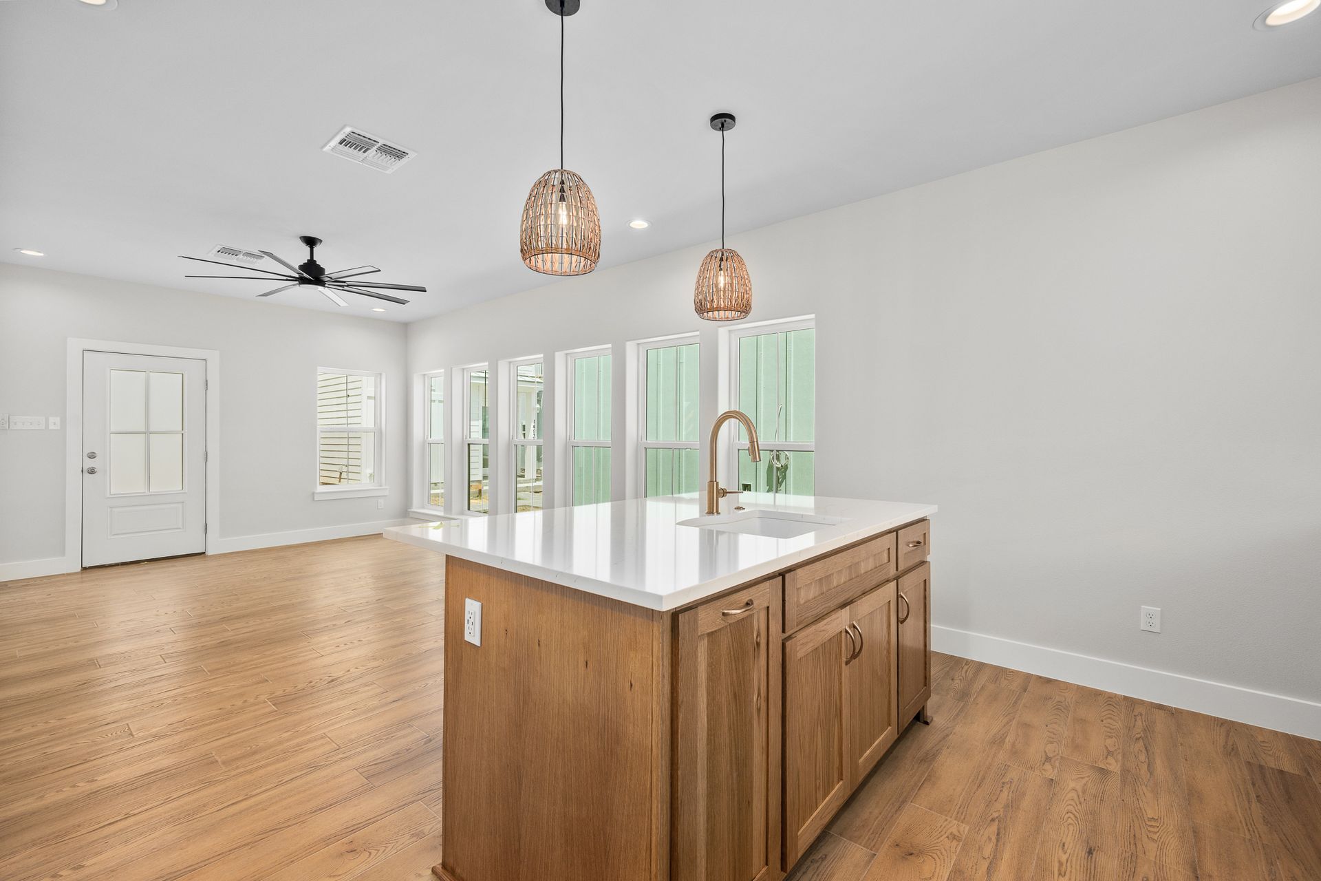 A kitchen with a large island in the middle of the room.
