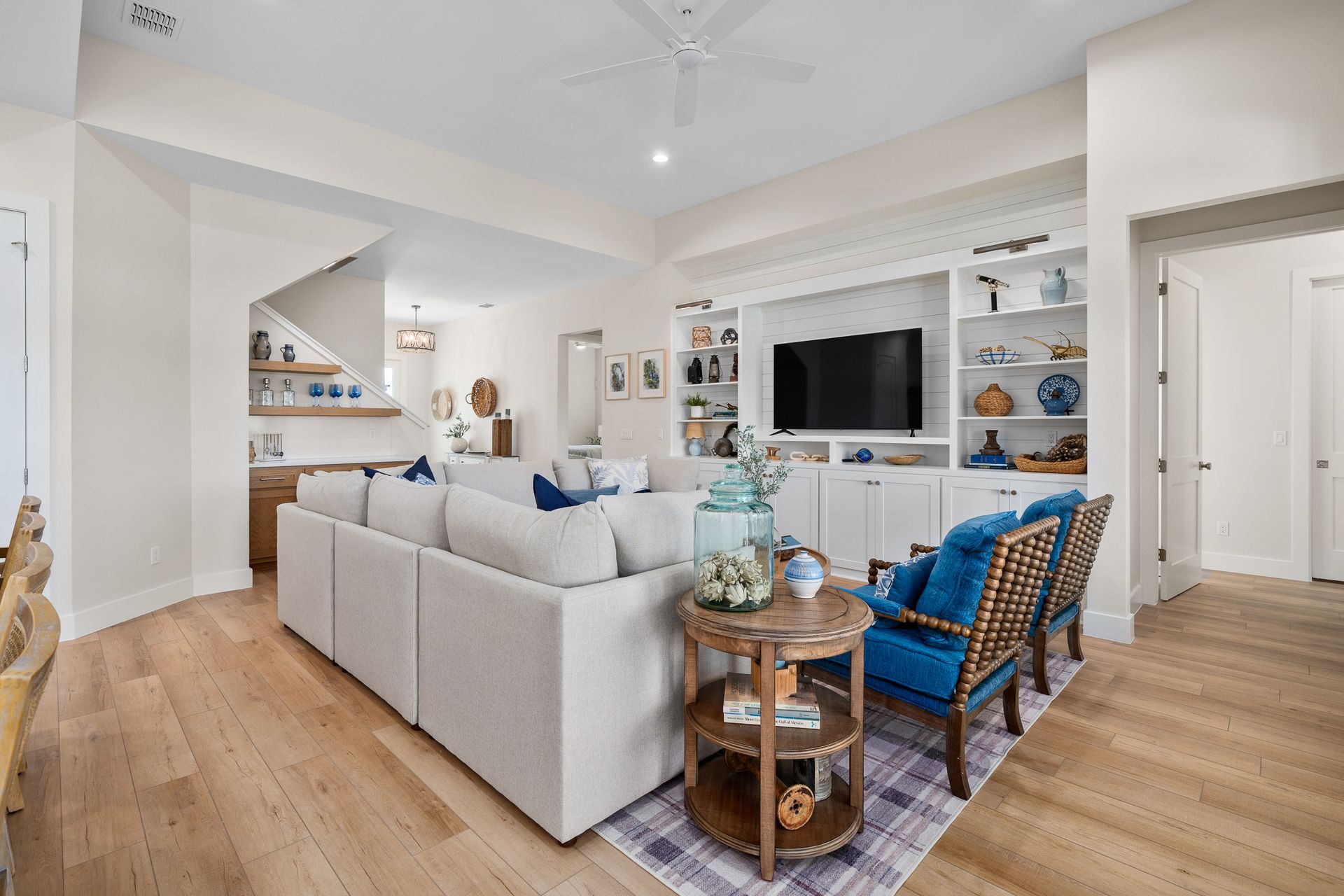 A living room filled with furniture and a flat screen tv.