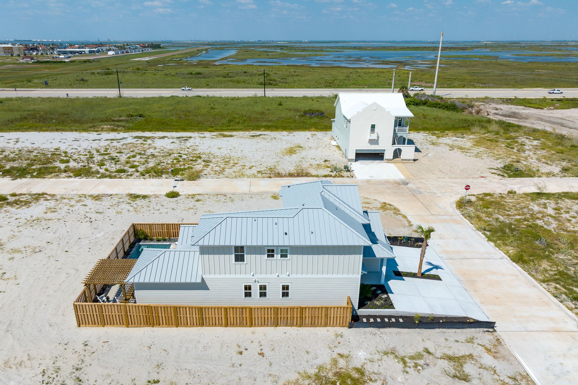 An aerial view of a house in the middle of a field