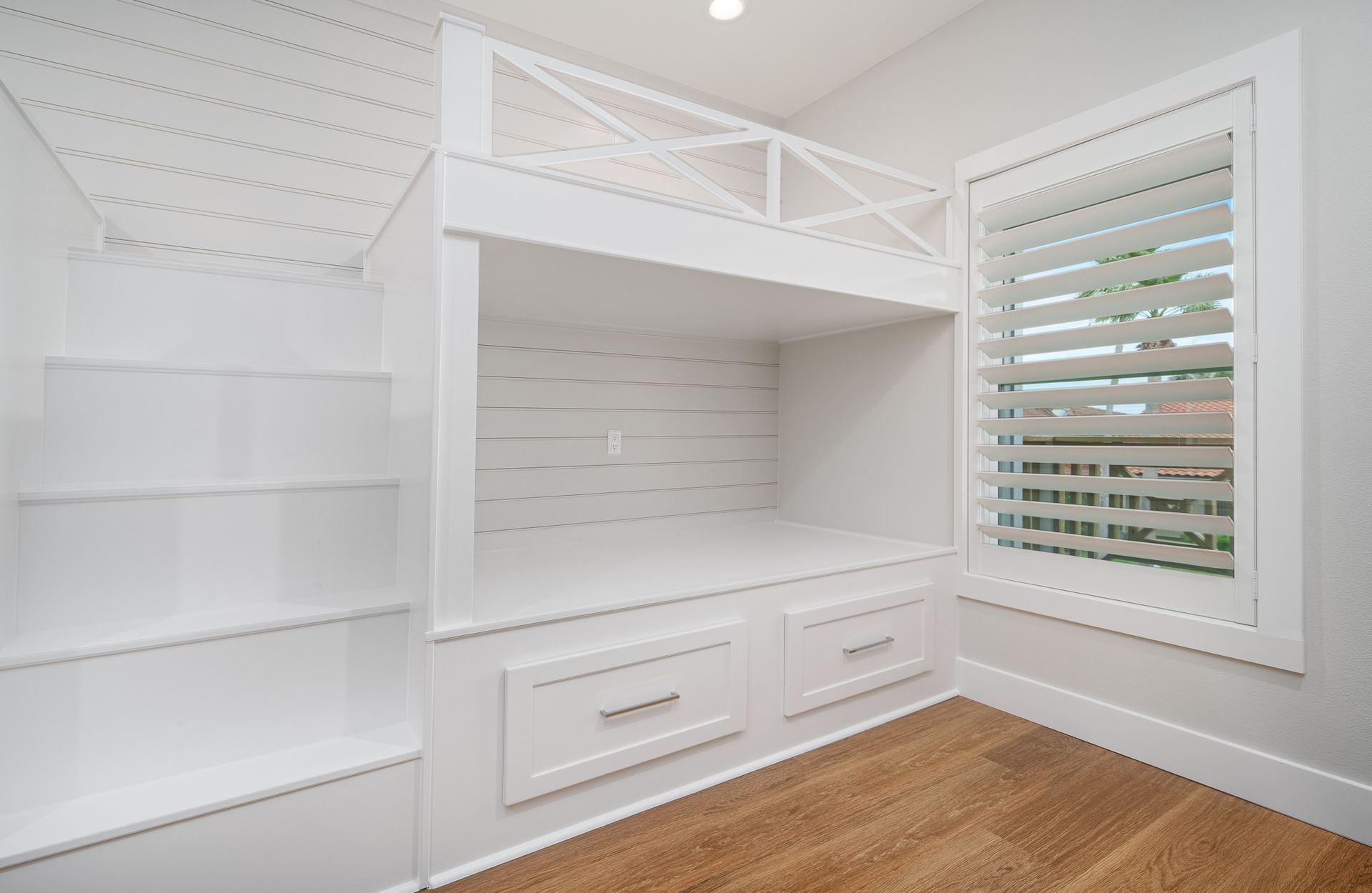 There is a bunk bed in the corner of the room.