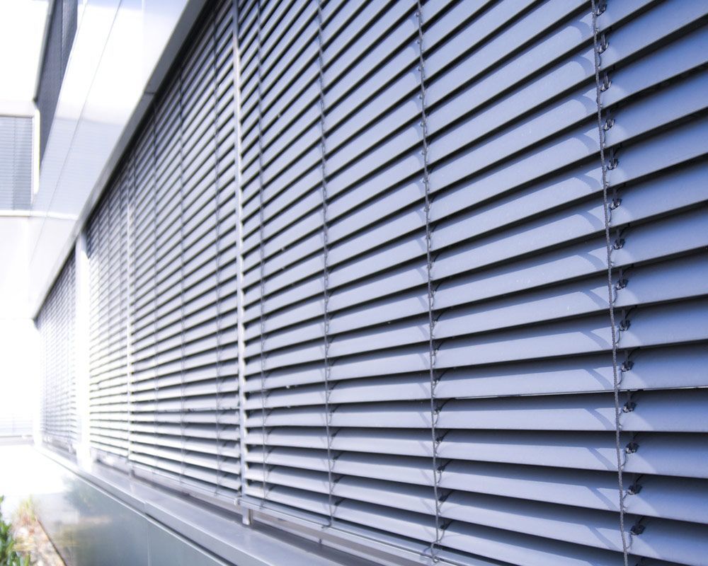 A Close up Of a Window with Blinds on It — Artizen Curtains in Mooloolaba, QLD