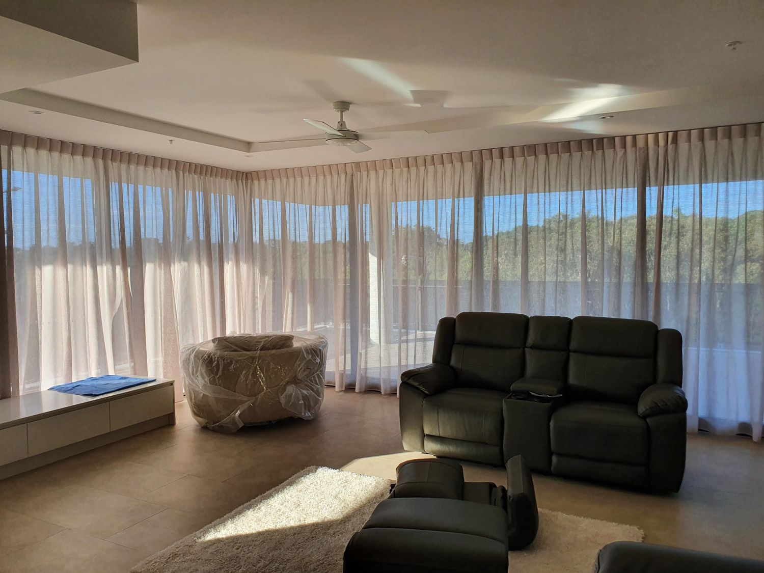 A Living Room With a Couch, Chairs, and Curtains — Artizen Curtains in Mooloolaba, QLD
