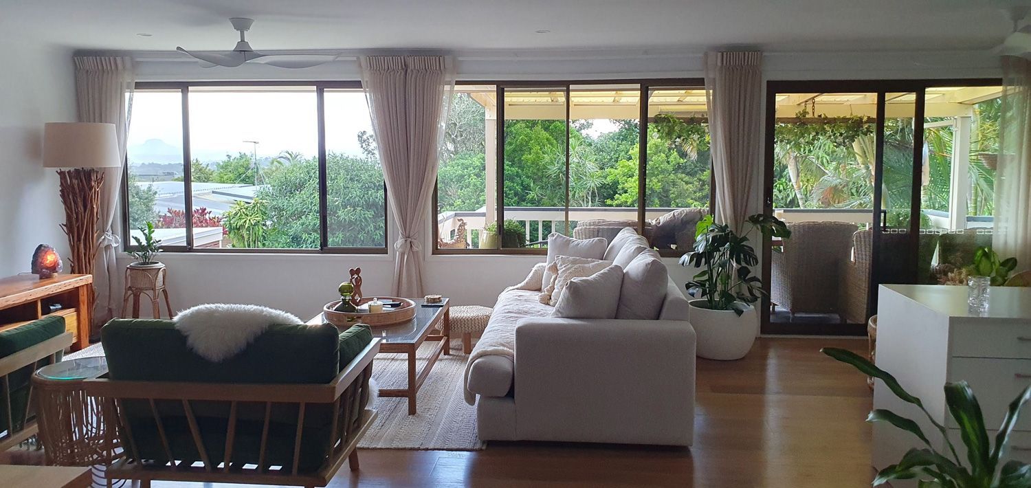 A Living Room Filled With Furniture and a Lot of Windows — Artizen Curtains in Mooloolaba, QLD