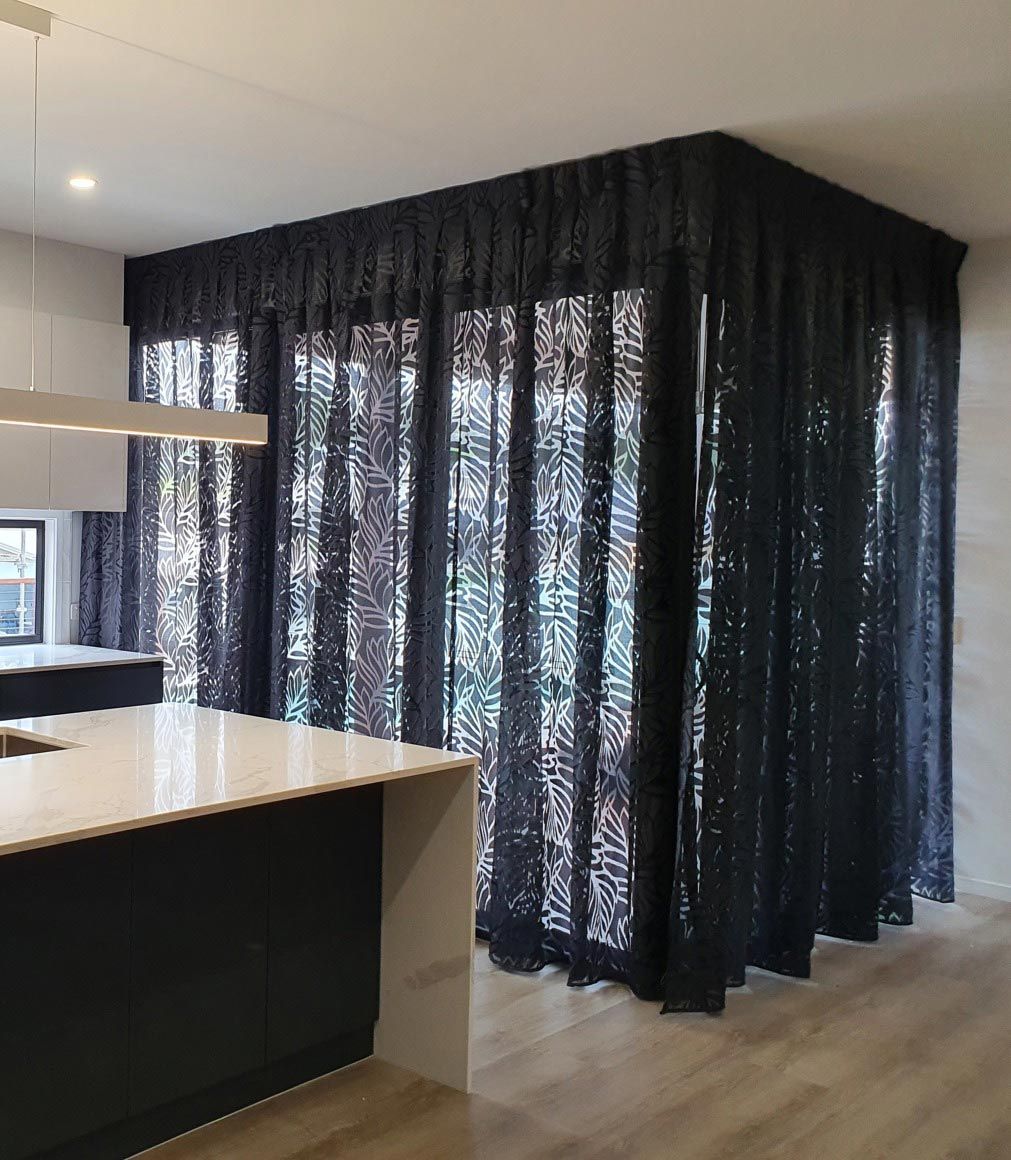A Kitchen With Black Curtains and a Sink — Artizen Curtains in Mooloolaba, QLD