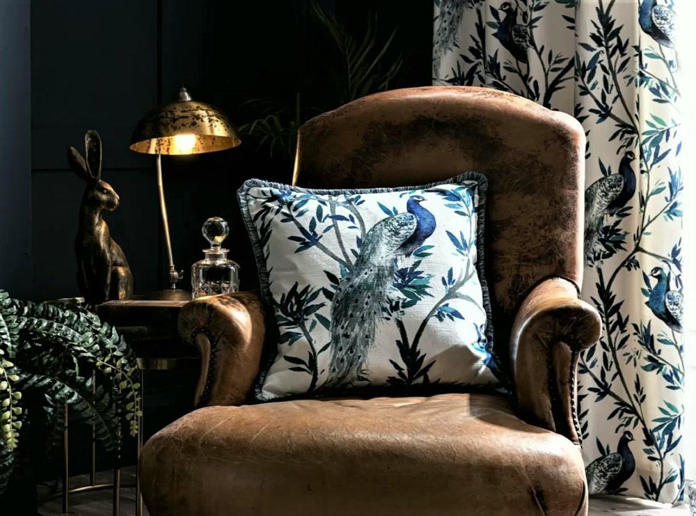 A Chair With a Pillow and a Lamp on It in a Living Room — Artizen Curtains in Mooloolaba, QLD
