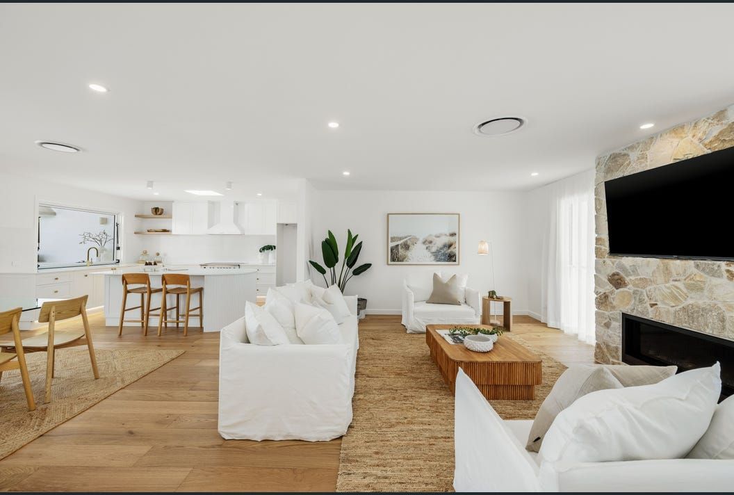 A Living Room Filled with Furniture and A Fireplace — Artizen Curtains in Maroochydore, QLD
