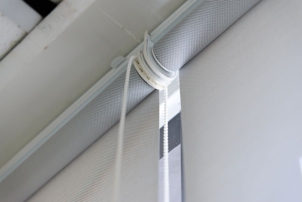A Close Up of a Roller Blind Hanging From the Ceiling — Artizen Curtains in Coolum, QLD