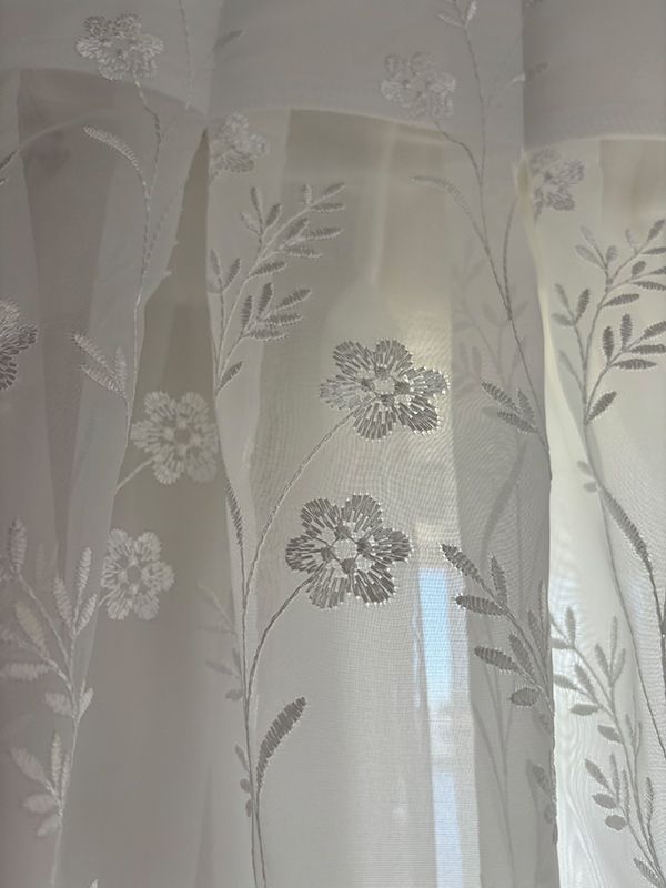 A Close Up of a White Curtain With Flowers on It — Artizen Curtains in Mooloolaba, QLD