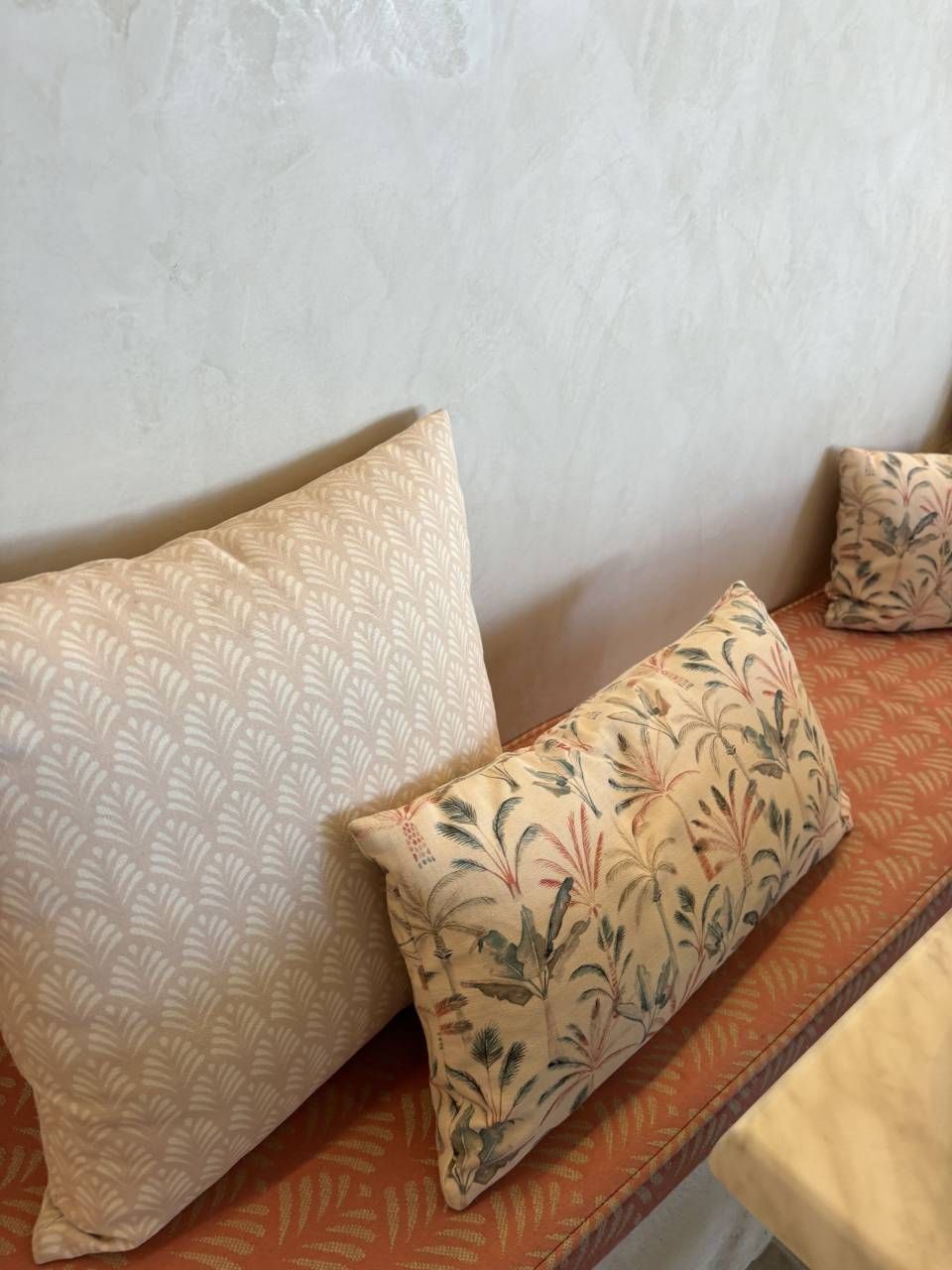 Two Pillows Are Sitting on a Bench in Front of a Wall — Artizen Curtains in Mooloolaba, QLD