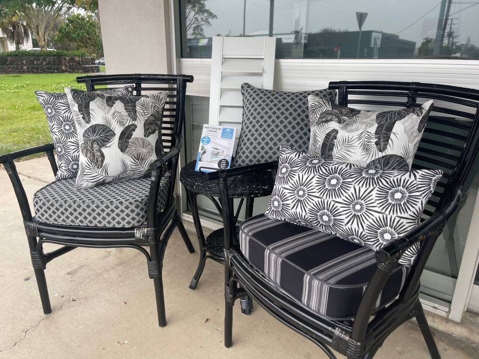 Two Chairs and a Table With Pillows on Them on a Porch — Artizen Curtains in Mooloolaba, QLD