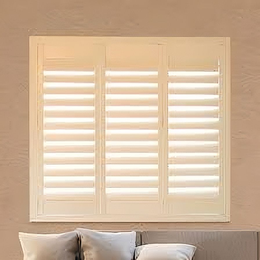 A Bedroom with A Bed and A Window with Shutters on It — Artizen Curtains in Mooloolaba, QLD